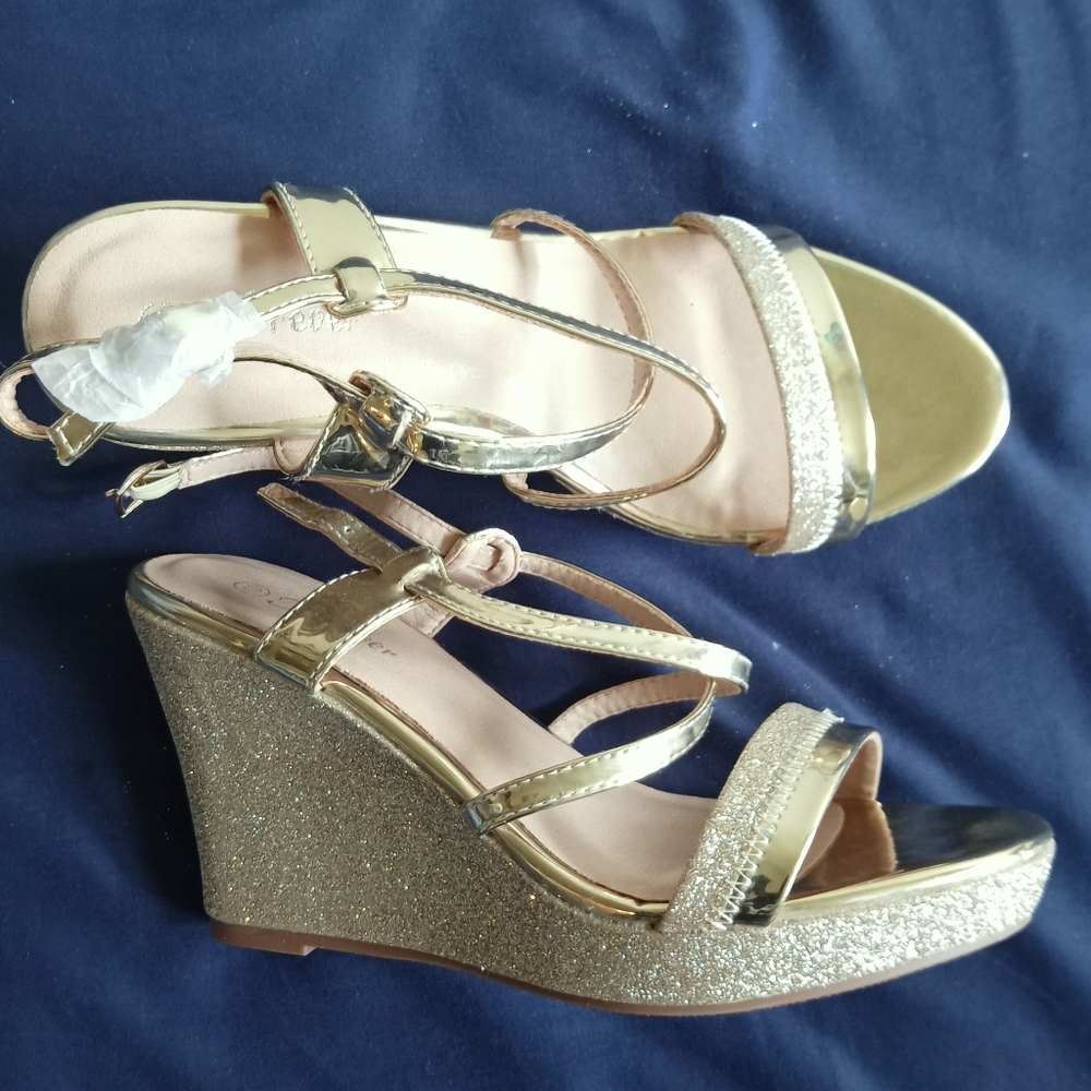 Woman's gold-colored wedge sandal